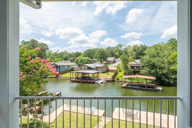 water view with a dock and a residential view