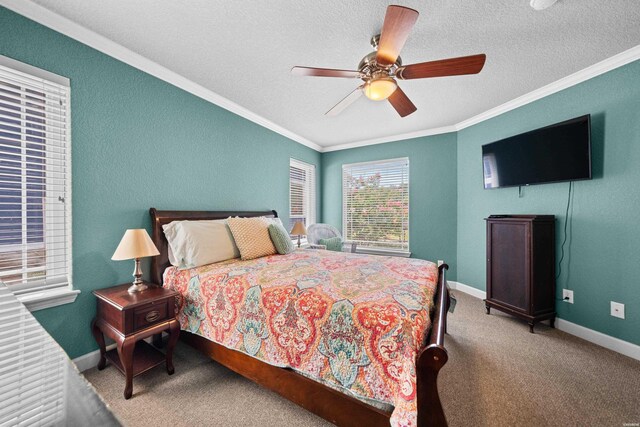 bedroom featuring baseboards, crown molding, and carpet flooring