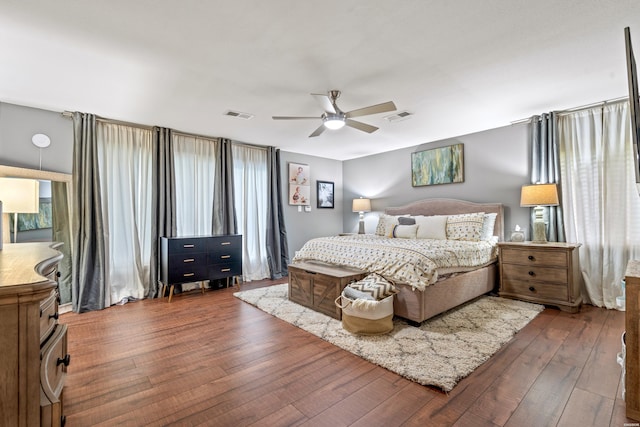 bedroom with wood-type flooring and a ceiling fan