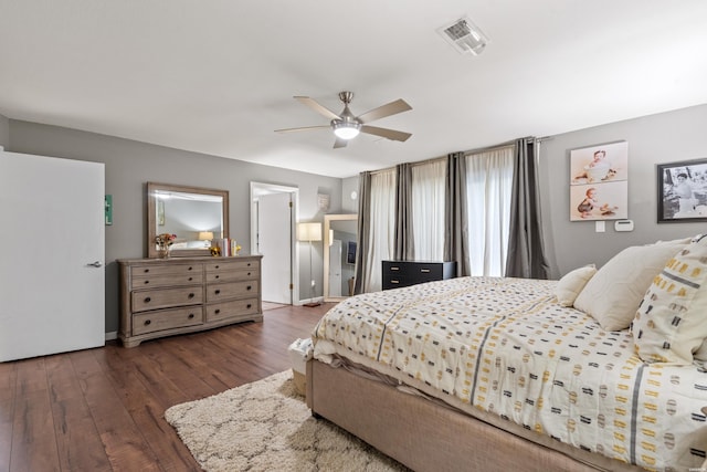 bedroom featuring hardwood / wood-style floors, ceiling fan, and baseboards
