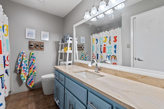 full bathroom featuring vanity, toilet, tile patterned floors, and curtained shower