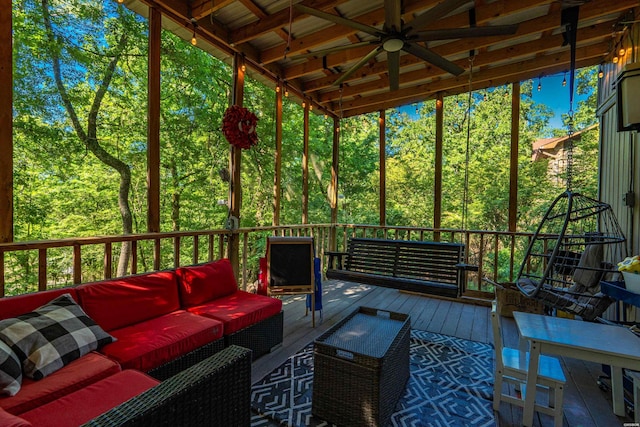 sunroom / solarium featuring an outdoor living space and ceiling fan