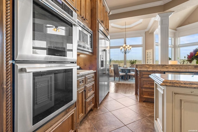 116 Lake Forest Shores Dr, Hot Springs, AR 71913 - kitchen with crown molding, a chandelier, hanging light fixtures, built in appliances, and brown cabinets
