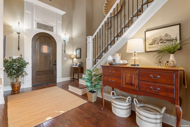 116 Lake Forest Shores Dr, Hot Springs, AR 71913 - entrance foyer featuring stairs, dark wood finished floors, baseboards, arched walkways, and a towering ceiling