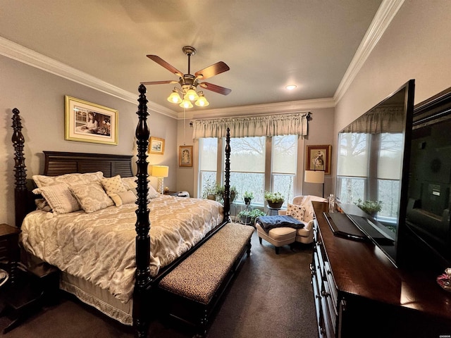 bedroom with dark colored carpet, a ceiling fan, and crown molding