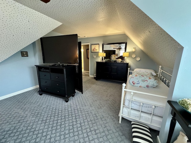 carpeted bedroom featuring lofted ceiling and baseboards