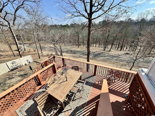 wooden terrace with outdoor dining area