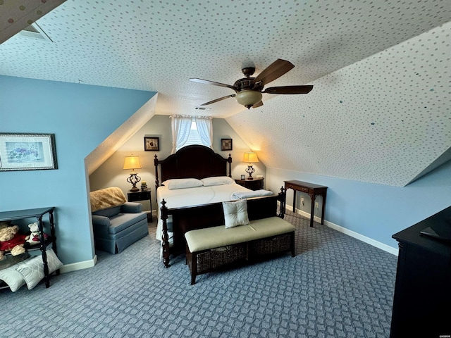 bedroom featuring a ceiling fan, carpet flooring, vaulted ceiling, and baseboards