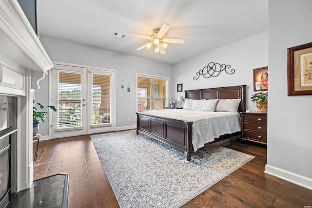 bedroom featuring baseboards, visible vents, a ceiling fan, dark wood-type flooring, and access to exterior