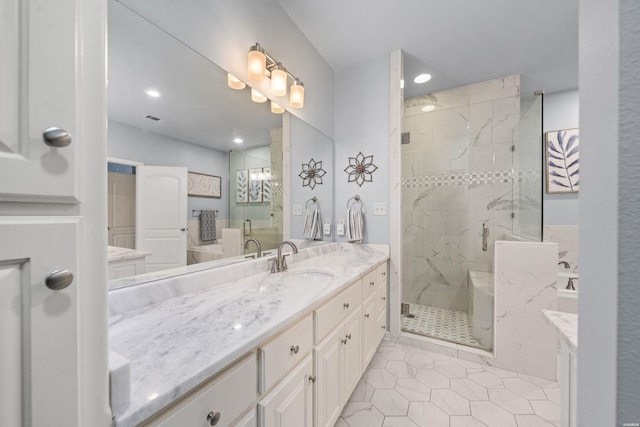 bathroom featuring a stall shower, vanity, recessed lighting, and tile patterned floors