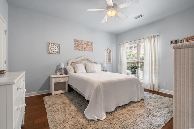 bedroom featuring ceiling fan, visible vents, and baseboards