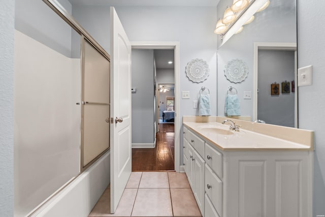 full bathroom with shower / bath combination with glass door, tile patterned flooring, and vanity