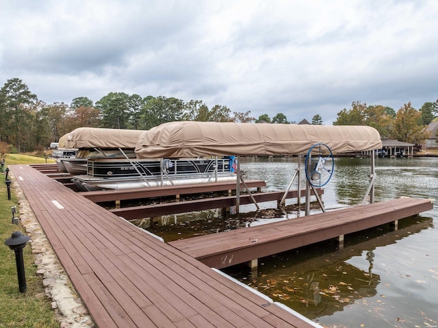 view of dock featuring a water view and boat lift