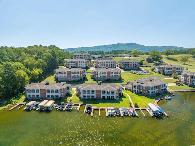 drone / aerial view with a water and mountain view