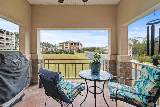 balcony with a ceiling fan, a sunroom, and area for grilling