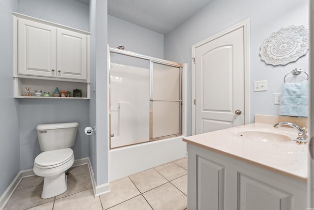 bathroom with tile patterned flooring, toilet, shower / bath combination with glass door, vanity, and baseboards