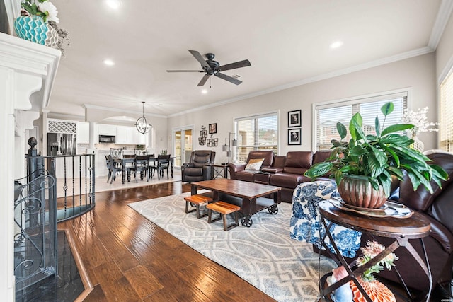 living area with crown molding, ceiling fan, wood finished floors, and recessed lighting