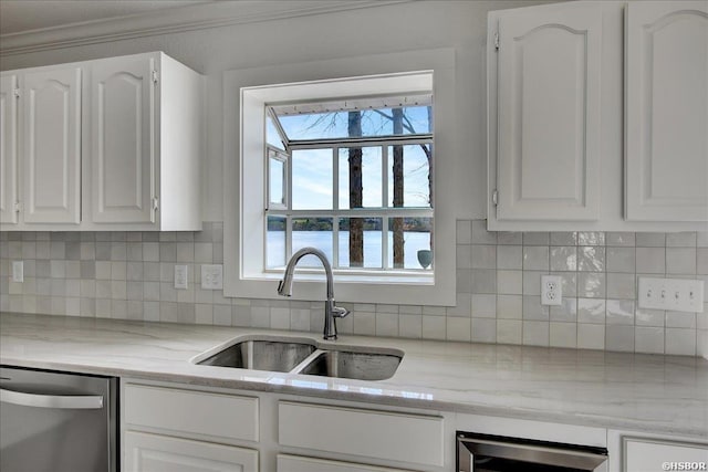 kitchen with white cabinetry, a water view, and dishwasher