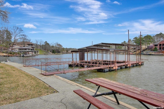 dock area featuring a residential view and a water view