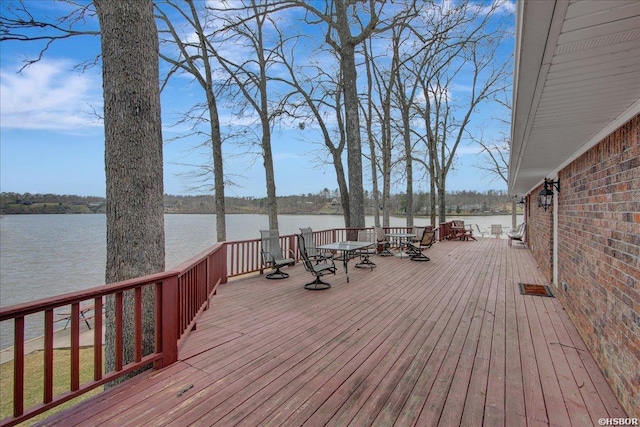 wooden deck featuring a water view