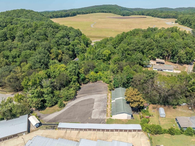 birds eye view of property with a wooded view