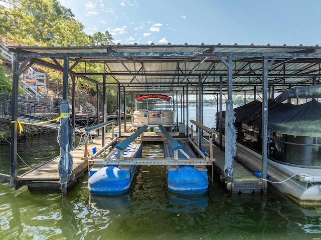 view of dock featuring a water view and boat lift