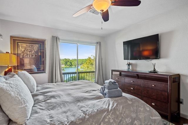 bedroom featuring access to exterior, visible vents, and ceiling fan