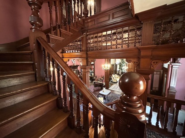 stairway with wood finished floors