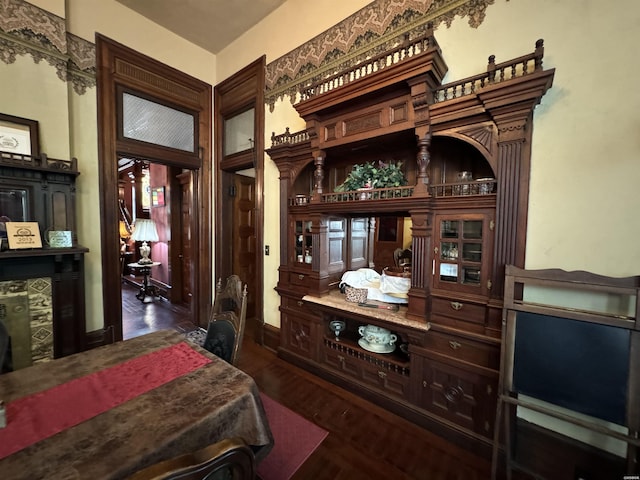 interior space with baseboards and dark wood-style flooring