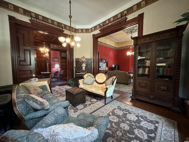 interior space with wood finished floors and an inviting chandelier