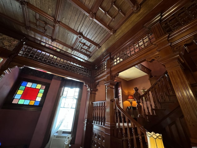 interior space featuring wooden ceiling, cooling unit, and ornate columns