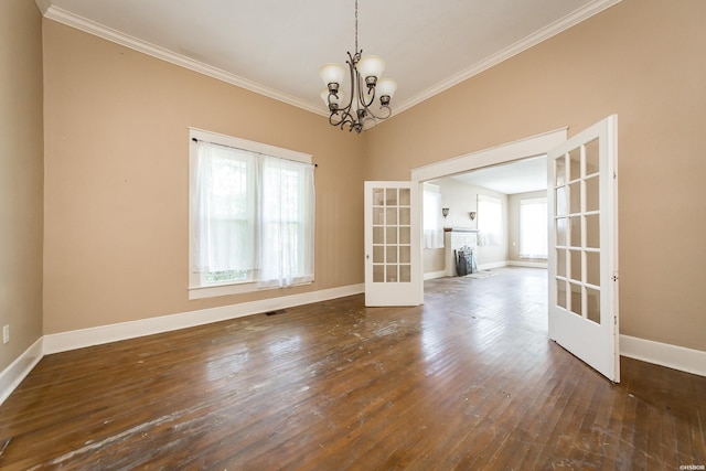 801 Crittenden St, Arkadelphia, AR 71923 - spare room featuring baseboards, dark wood finished floors, crown molding, and french doors