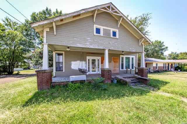 801 Crittenden St, Arkadelphia, AR 71923 - view of front of house with a porch and a front yard