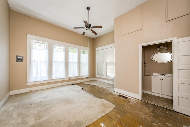 801 Crittenden St, Arkadelphia, AR 71923 - empty room featuring visible vents, ceiling fan, a sink, and baseboards