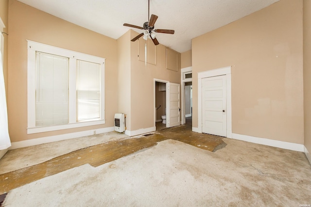 801 Crittenden St, Arkadelphia, AR 71923 - interior space featuring heating unit, high vaulted ceiling, baseboards, and a ceiling fan