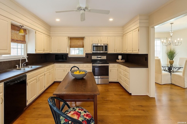 338 Sunset Bay Rd, Hot Springs, AR 71913 - kitchen with black appliances, dark countertops, decorative backsplash, a chandelier, and recessed lighting