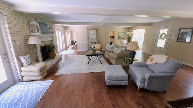 338 Sunset Bay Rd, Hot Springs, AR 71913 - living room with beam ceiling, wood finished floors, a fireplace, and a ceiling fan