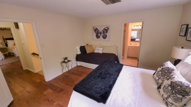 338 Sunset Bay Rd, Hot Springs, AR 71913 - bedroom with wood finished floors and ensuite bathroom