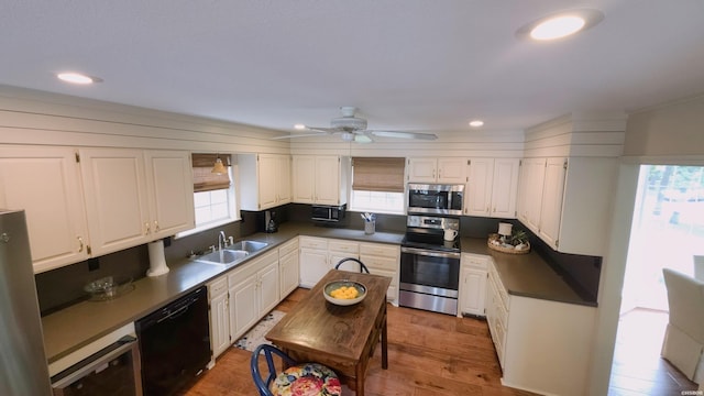 338 Sunset Bay Rd, Hot Springs, AR 71913 - kitchen with stainless steel appliances, dark countertops, white cabinetry, and recessed lighting
