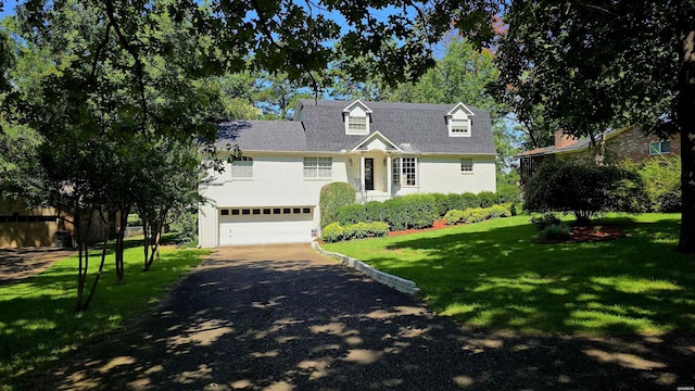338 Sunset Bay Rd, Hot Springs, AR 71913 - new england style home featuring asphalt driveway, a garage, and a front yard