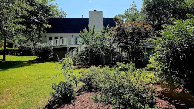 338 Sunset Bay Rd, Hot Springs, AR 71913 - back of property featuring stairs, a yard, a chimney, and a wooden deck