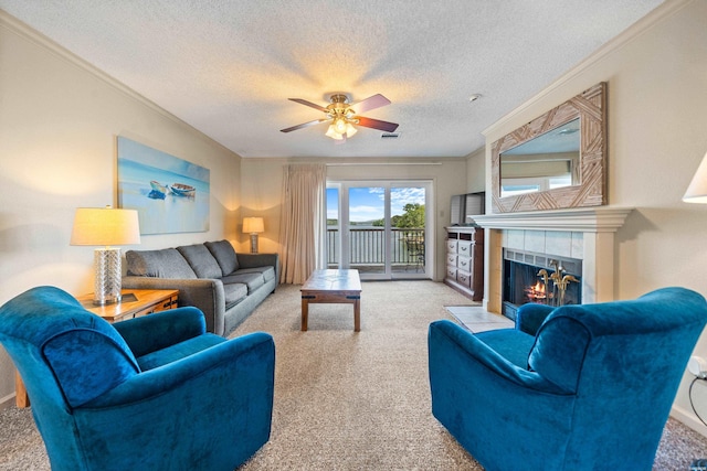 5371 Central Ave Unit 6J, Hot Springs, AR 71913 - carpeted living room with a tiled fireplace, ceiling fan, a textured ceiling, and ornamental molding