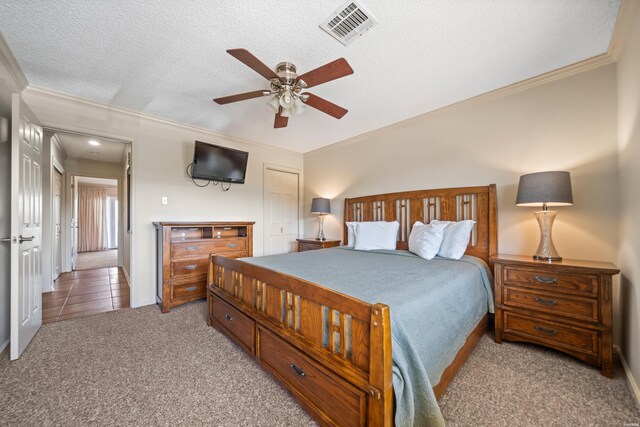 5371 Central Ave Unit 6J, Hot Springs, AR 71913 - carpeted bedroom featuring ornamental molding, a textured ceiling, a ceiling fan, and baseboards