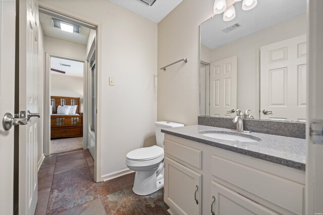 5371 Central Ave Unit 6J, Hot Springs, AR 71913 - bathroom featuring toilet, vanity, and baseboards