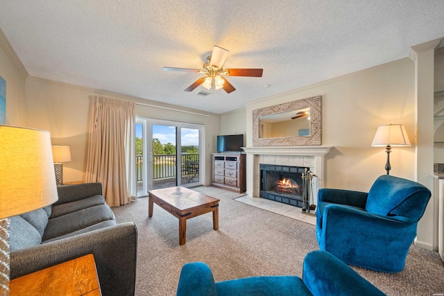 5371 Central Ave Unit 6J, Hot Springs, AR 71913 - living room featuring ornamental molding, a tiled fireplace, carpet, ceiling fan, and a textured ceiling