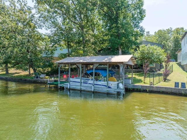 view of dock featuring a water view and boat lift