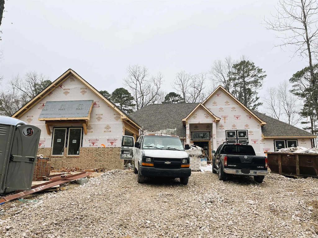 property under construction featuring brick siding