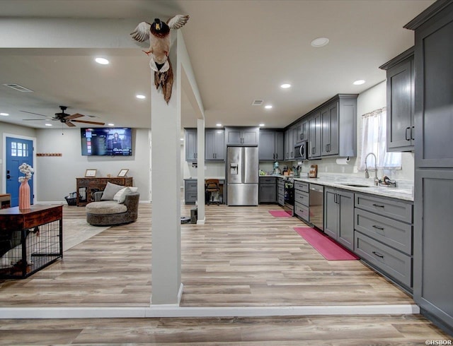 111 Westgate Ter, Hot Springs, AR 71913 - kitchen with recessed lighting, stainless steel appliances, a sink, visible vents, and light wood-style flooring