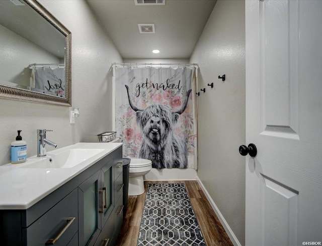111 Westgate Ter, Hot Springs, AR 71913 - full bath with visible vents, toilet, vanity, and wood finished floors