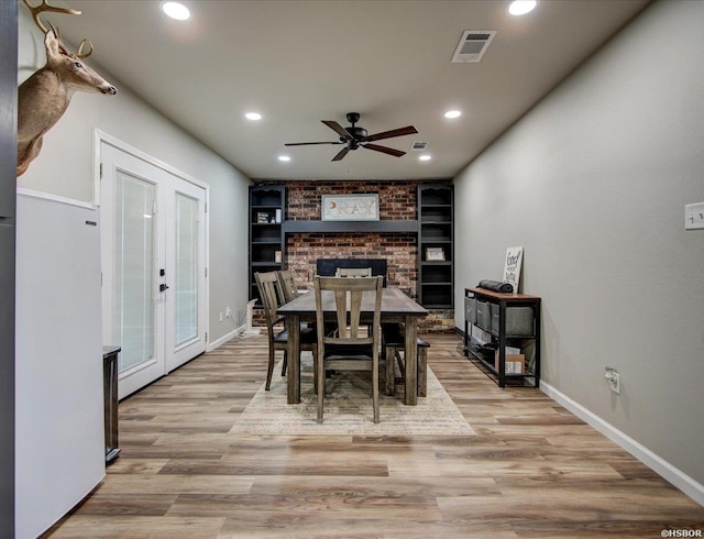 111 Westgate Ter, Hot Springs, AR 71913 - dining space featuring french doors, light wood-style floors, ceiling fan, and visible vents